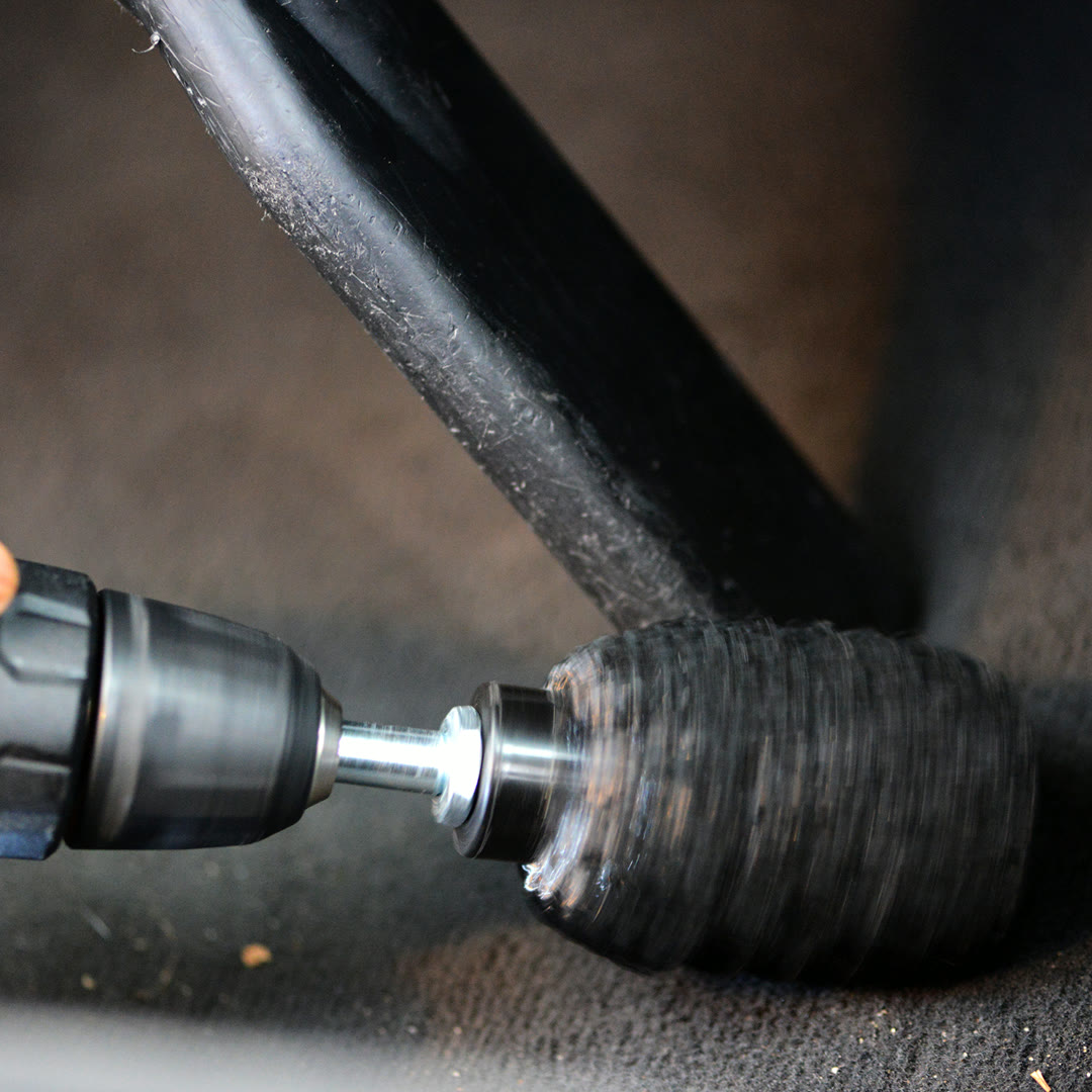 SB-003 Carpet Brush working a car carpet, mid-spin