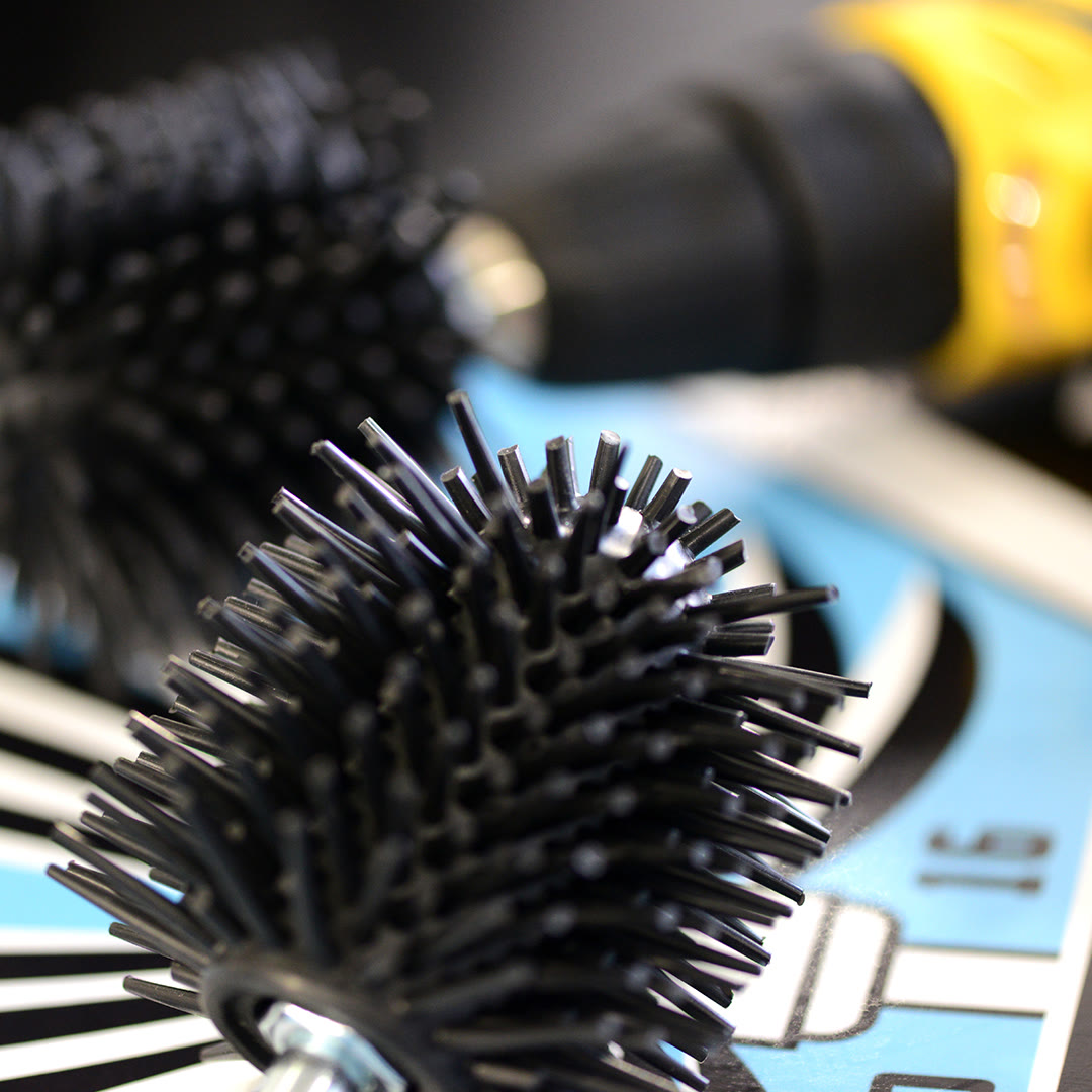 SB-005 Hair Removal — silicone heads, studio packshot on the emblem backdrop