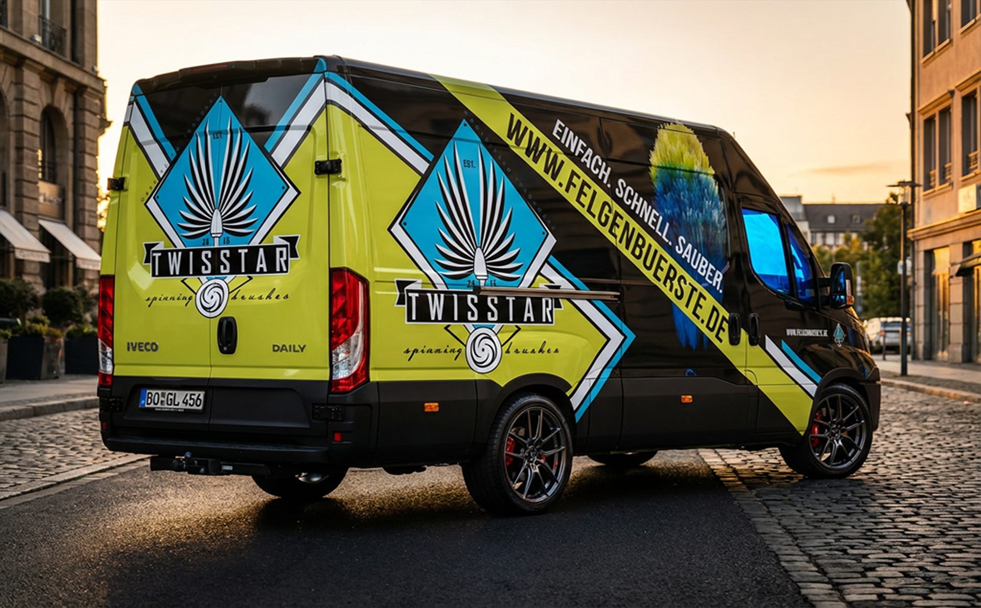 TwistStar transporter at golden hour — diamond emblems, lime panels and WWW.FELGENBUERSTE.DE across the IVECO body.